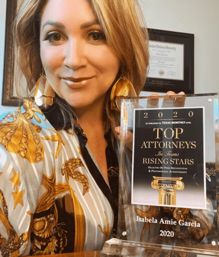 Isabela Amie Garcia holding her 2020 Texas Rising Stars Top Attorneys award